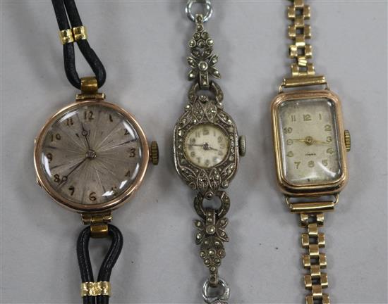 Two ladys 9ct gold wrist watches and a marcasite wrist watch.